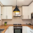 LAMPADA A SOSPENSIONE LEDA IN METALLO NERO A FORMA CONICA INTERNO IN ORO 100H CM