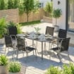 Set da Esterno 7pz con 6 Sedie Impilabili in Texteline e Tavolino da CaffÞ con Piano in Vetro, Nero e Argento