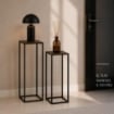 2 COLONNINE IN METALLO NERO MISURE 23X60CM E 27X70CM CON BASE IN MDF COLOR LEGNO